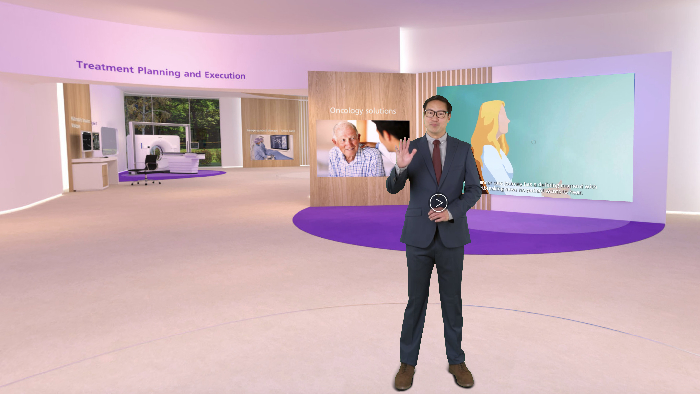 a man in a suit in a room with a screen