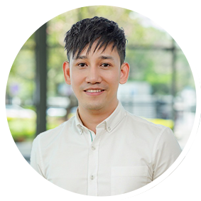 a man smiling at the camera